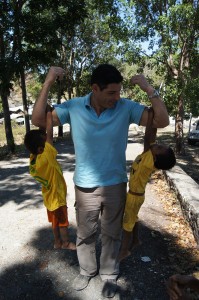 [Macquarie Telecom’s George Drouvalakis makes friends easily with young Balibo locals]